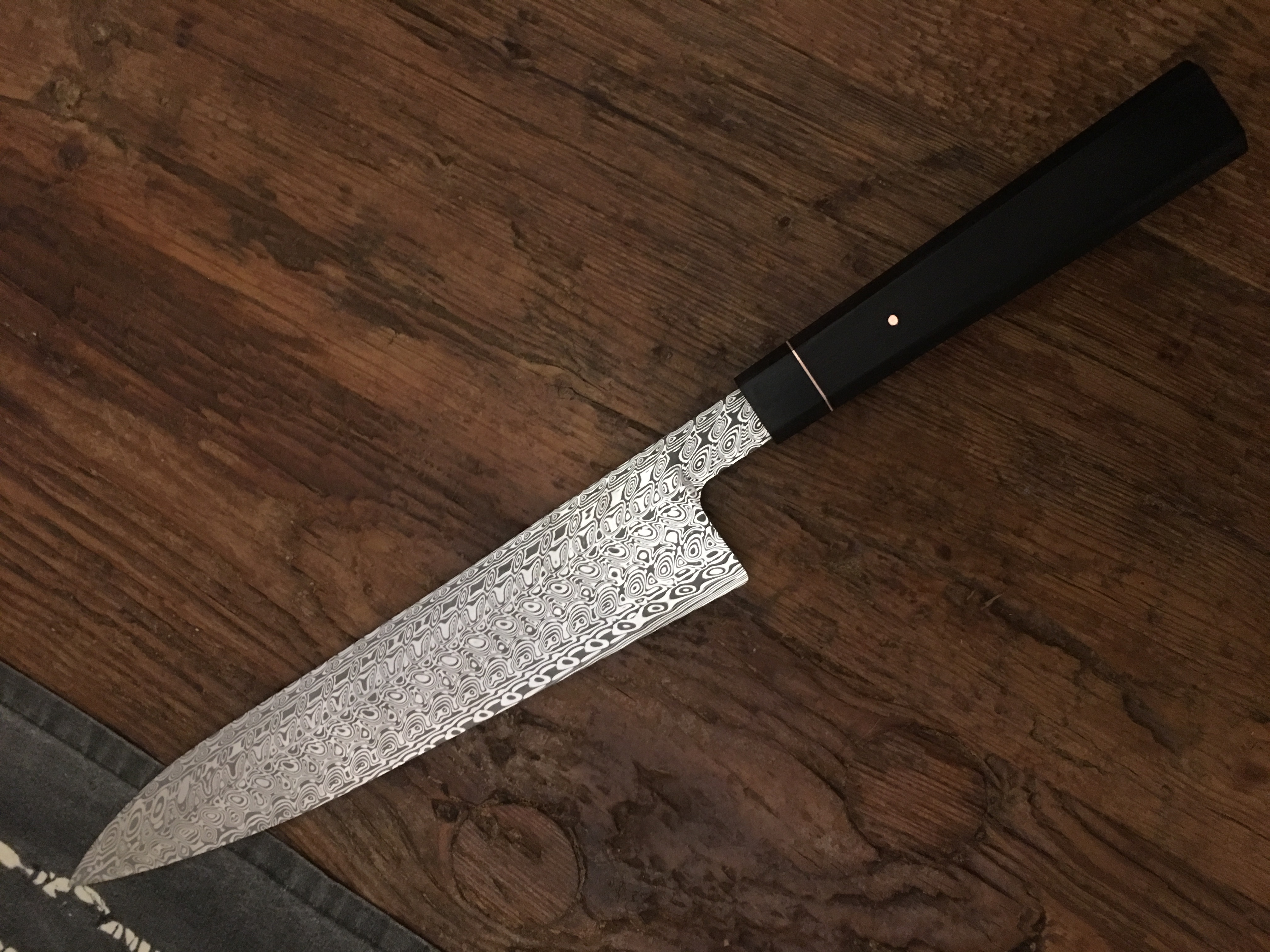 This was a commission that was changed so I had this for the DEKS show where it won best of show Kitchen knife!!! Agier pattern by Damasteel with African black ivory handle and copper.